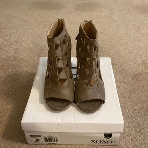 XOXO Cutout zip up heeled booties.